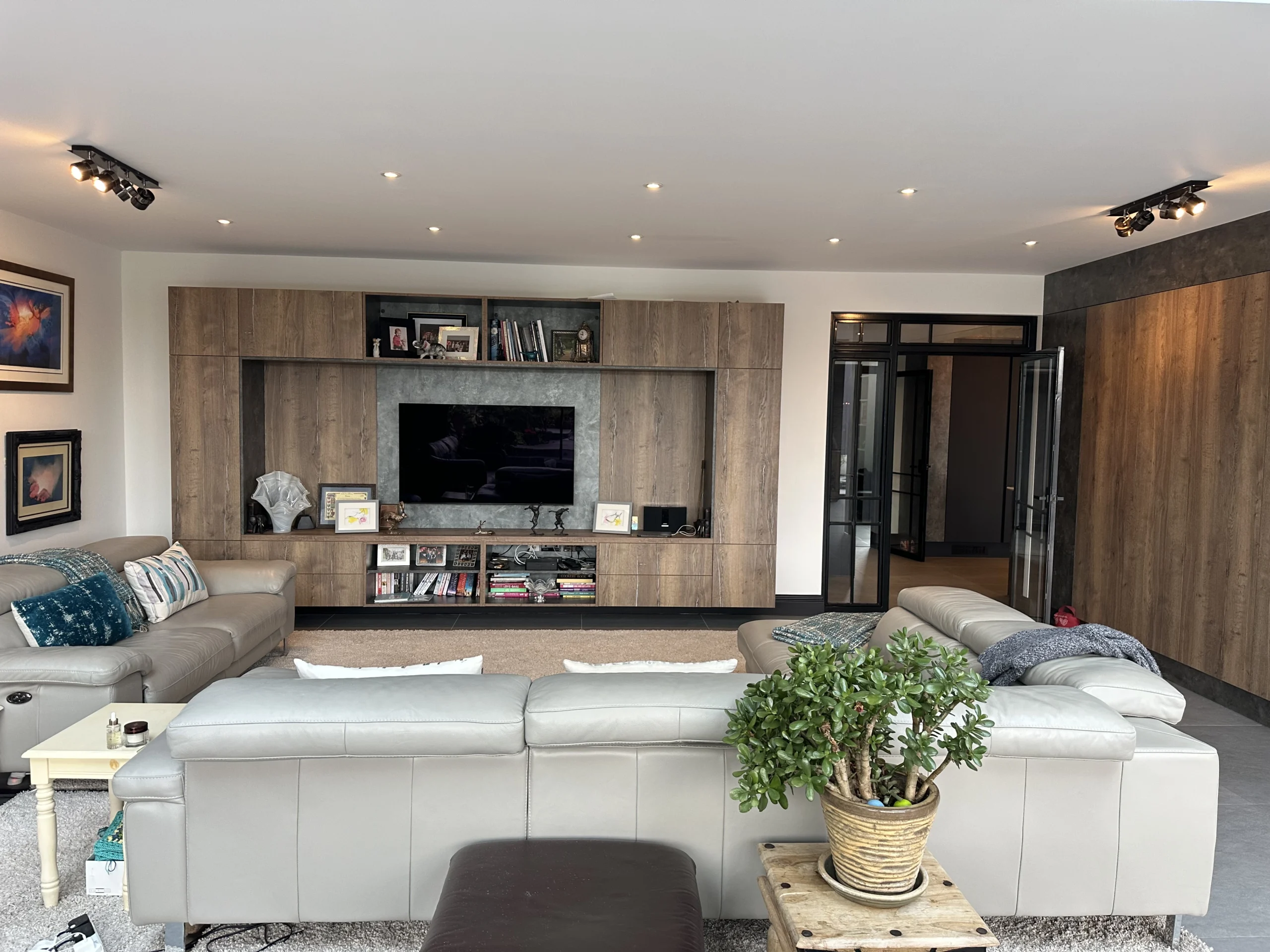Open-plan living room with feature lighting