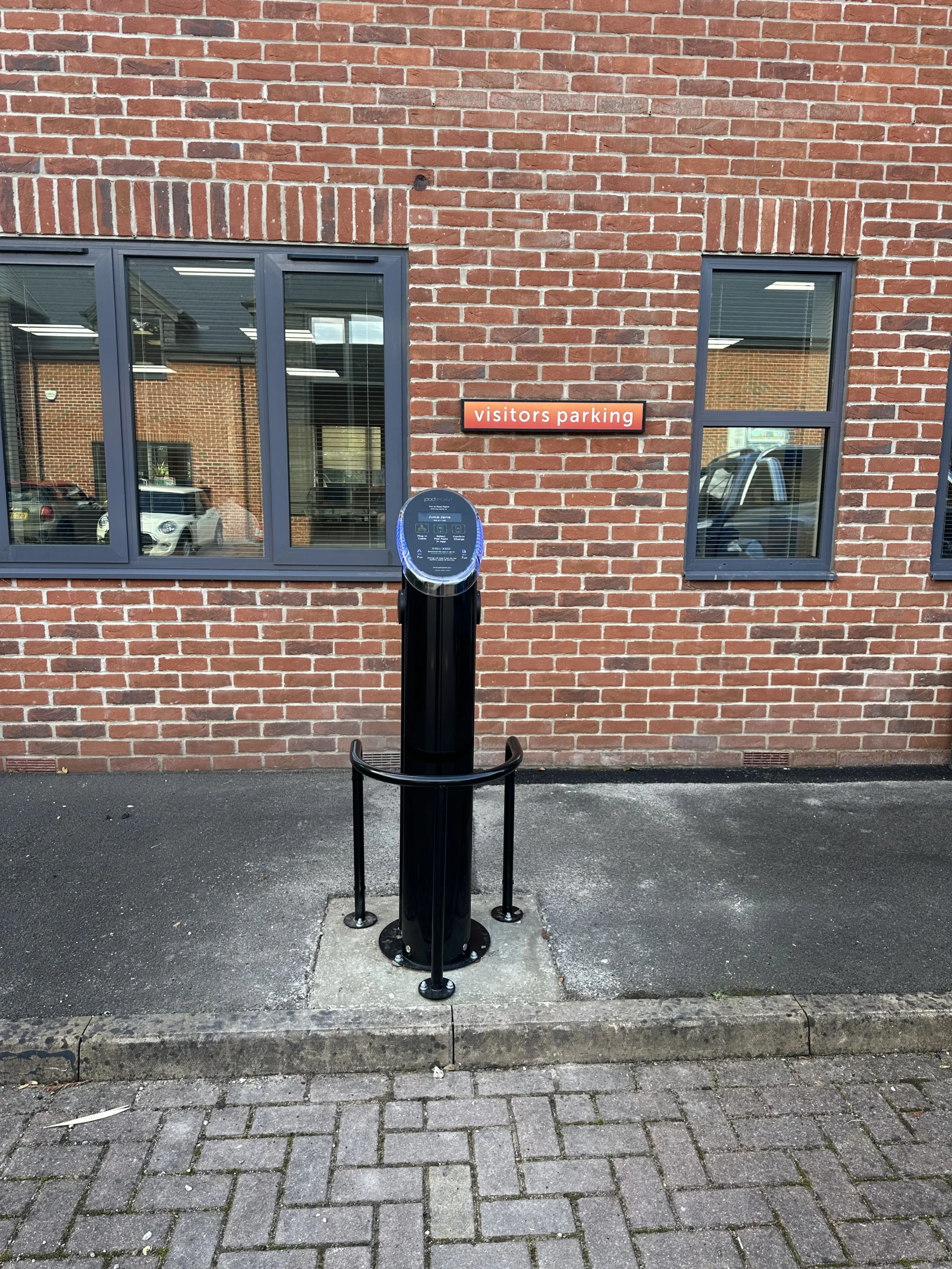 EV charging pedestal outside a commercial building